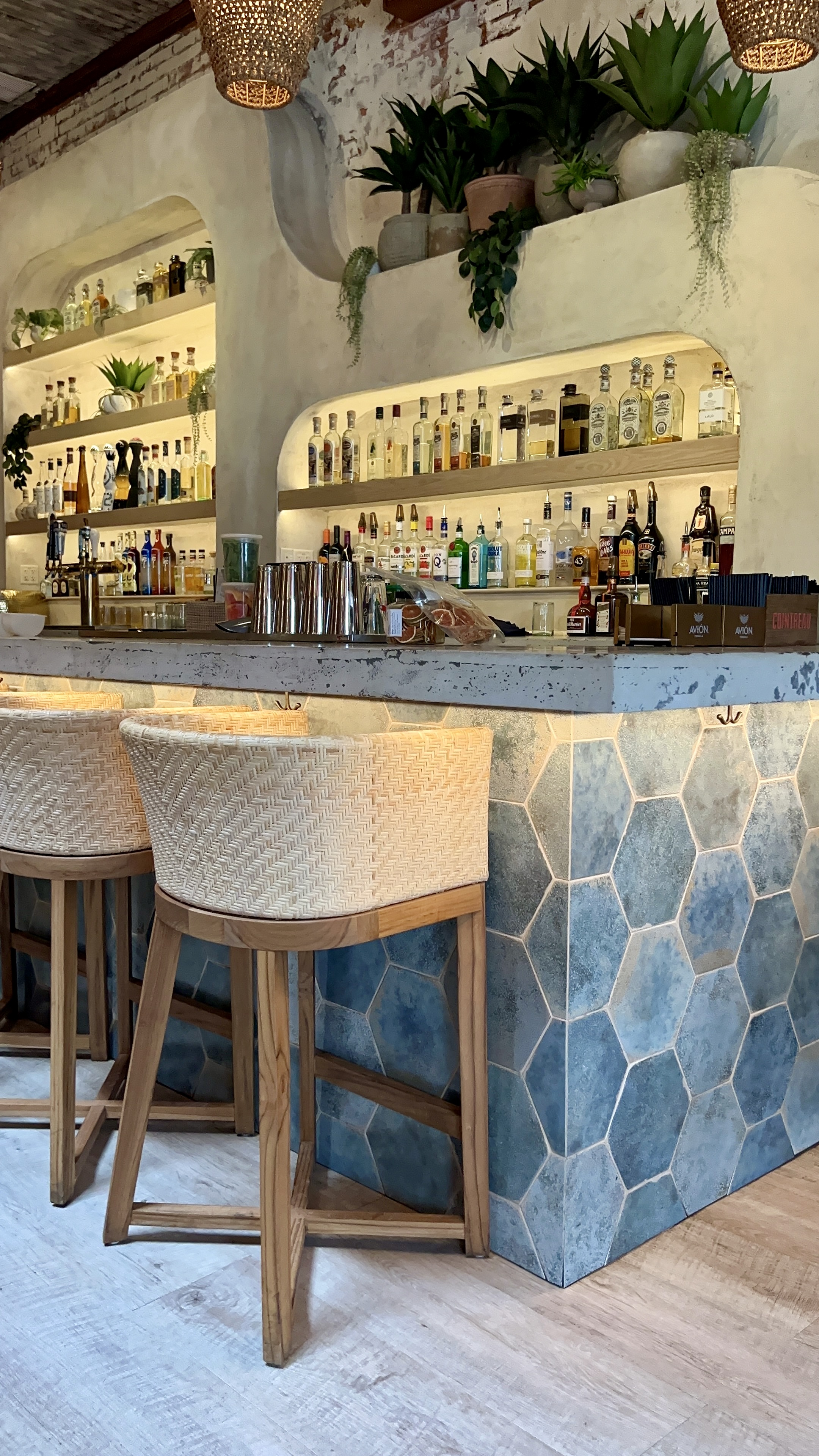 Restaurant bar clad in blue hexagonal tile